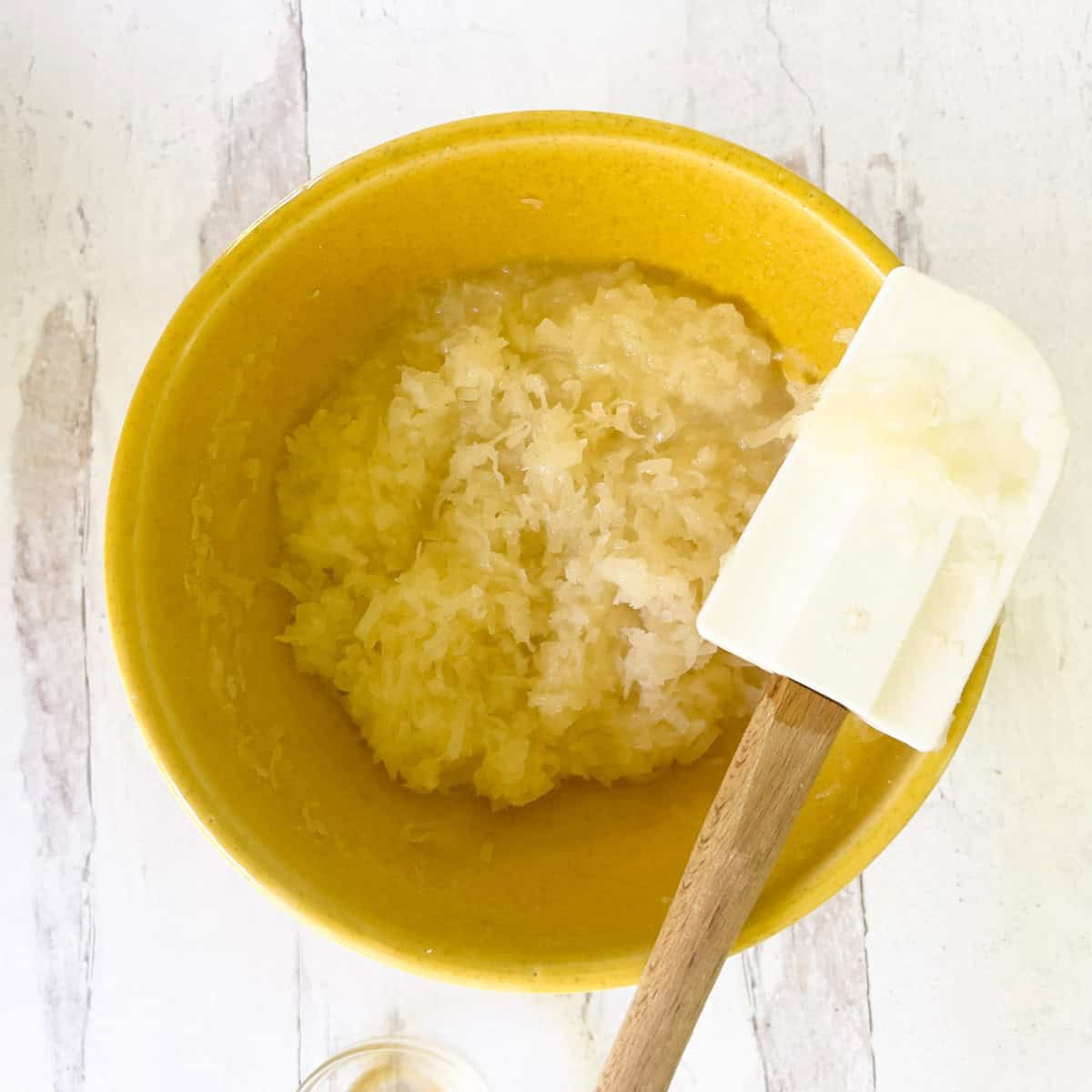 Coconut macaroon mixture in yellow bowl.