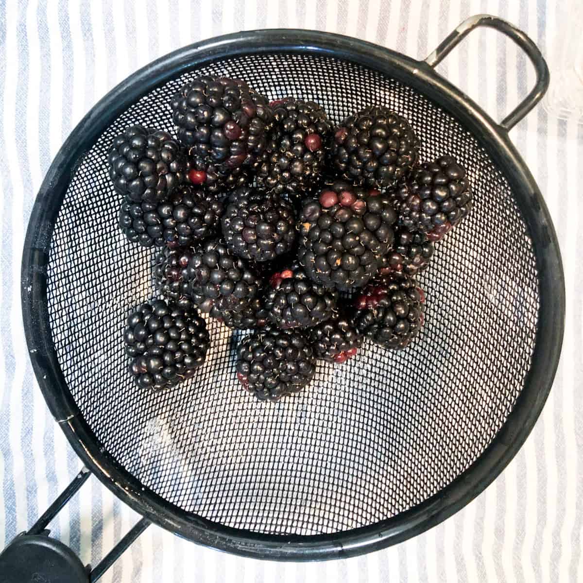 Blackberries in mesh strainer