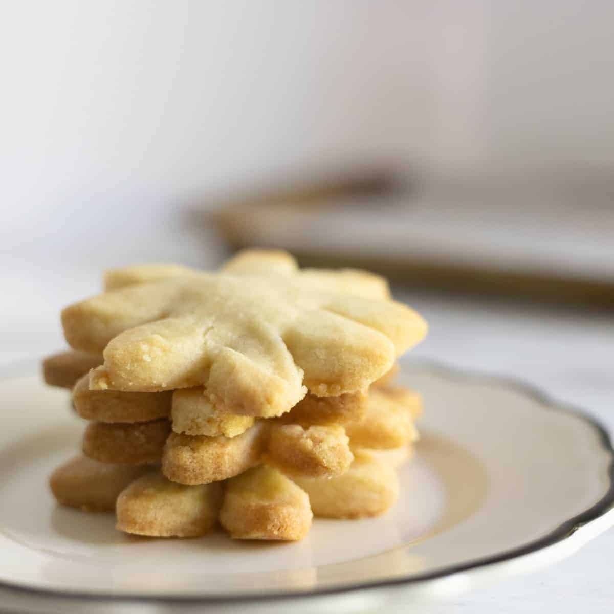 Stack of flower shaped butter cookies.