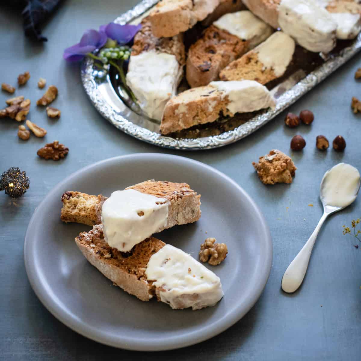 White chocolate dipped Biscotti on silver tray.