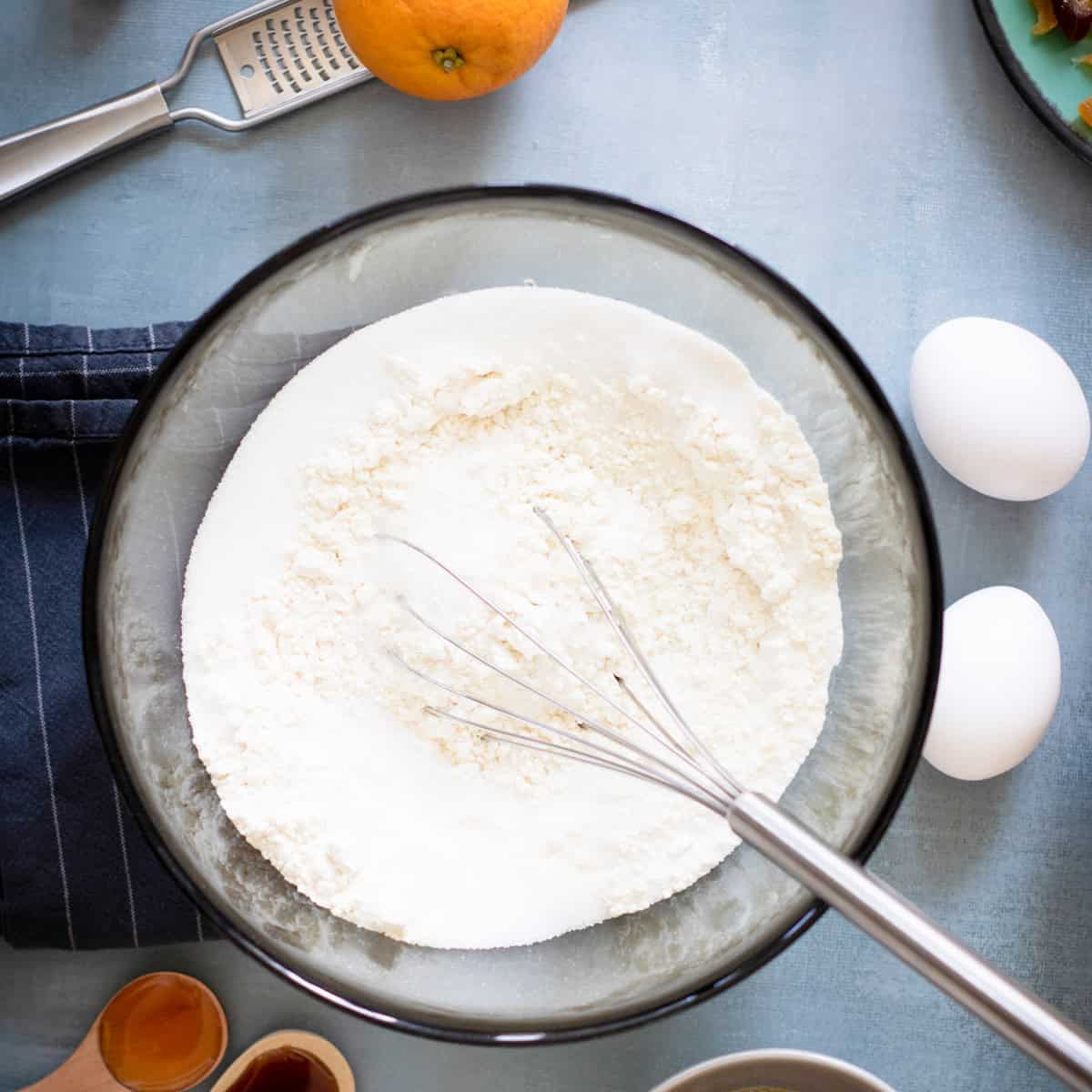 Flour in bowl with whisk.